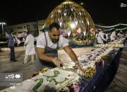 عکس/ پخت و توزیع کیک ۵ تُنی در مشهد